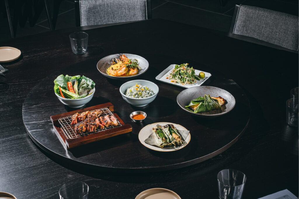 Birthday dinner in KL with shared dishes served on a round table in a private dining setting.